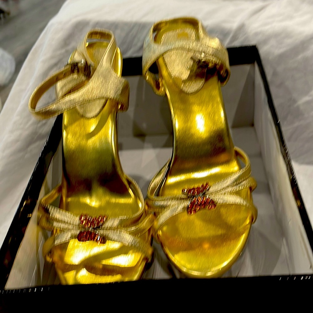 Gold high heel shoes